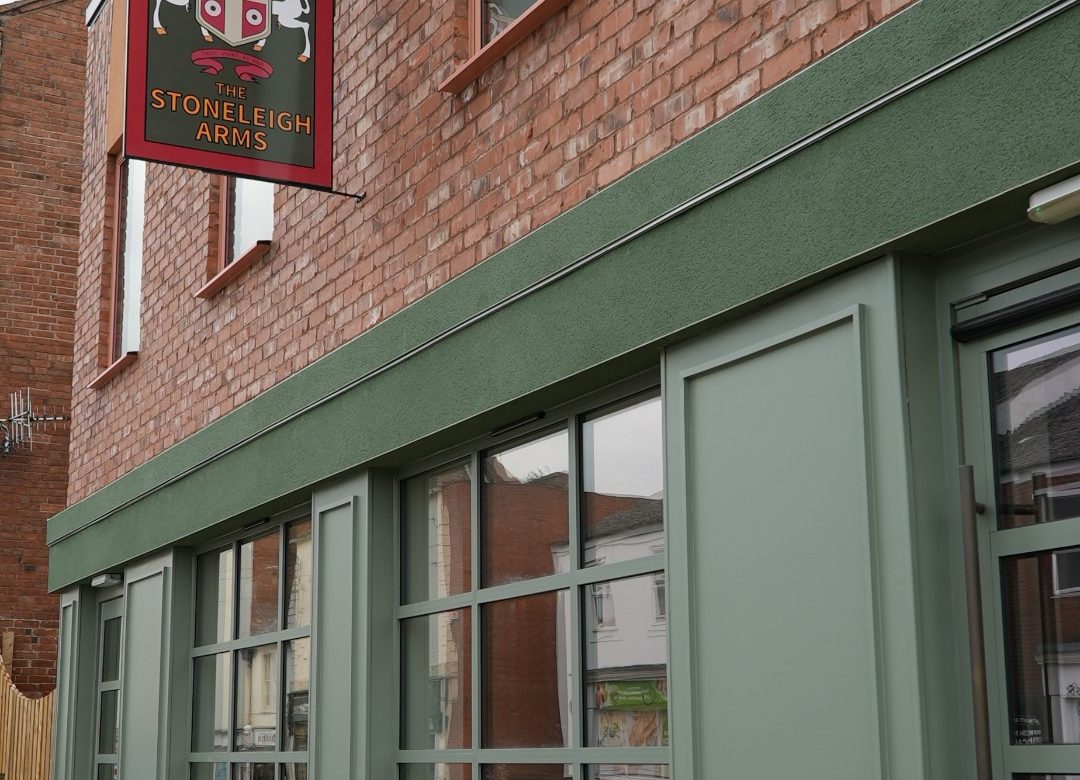 The Stoneleigh Arms front entrance on Clemmons St, Leamington Spa with a green and open brick facade